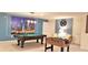 Spacious game room featuring a pool table, foosball table, and a vibrant city skyline mural at 8924 Bengal Ct, Kissimmee, FL 34747