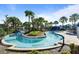 The community's wonderful lazy river with lush landscaping and resort-style amenities at 8924 Bengal Ct, Kissimmee, FL 34747