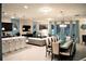 Bright, open-concept living space features a dining area, modern furniture, and stylish decorations at 8924 Bengal Ct, Kissimmee, FL 34747