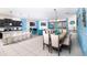 Bright, open-concept living space features a dining area, modern furniture, and stylish decorations at 8924 Bengal Ct, Kissimmee, FL 34747