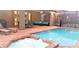 Relaxing screened pool with a jacuzzi, outdoor furniture, and views of the well-appointed patio area at 8924 Bengal Ct, Kissimmee, FL 34747