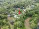 An aerial view highlights the home's location within a lush, tree-filled neighborhood, providing a serene and private setting at 903 Oak Leaf Ct, Altamonte Springs, FL 32714