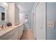 Bathroom with double sinks, marble countertops, white cabinets, and a tile floor at 903 Oak Leaf Ct, Altamonte Springs, FL 32714
