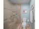 Modern bathroom features a glass-enclosed shower, tile surround, and neutral color scheme at 903 Oak Leaf Ct, Altamonte Springs, FL 32714