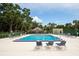 A large, inviting community pool surrounded by lounge chairs and lush greenery, offering a perfect spot for relaxation and recreation at 903 Oak Leaf Ct, Altamonte Springs, FL 32714
