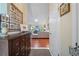Hallway view leading to the living area featuring wood floors and abundant natural light at 903 Oak Leaf Ct, Altamonte Springs, FL 32714