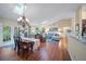 Open-concept living and dining area with abundant natural light and a view of the well-equipped kitchen at 903 Oak Leaf Ct, Altamonte Springs, FL 32714