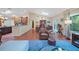 Spacious living room flowing into a dining area and kitchen, featuring hardwood floors and natural light at 903 Oak Leaf Ct, Altamonte Springs, FL 32714