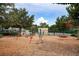 A wide view of a playground with mature trees and ample space for recreation, including a swing set and merry-go-round at 903 Oak Leaf Ct, Altamonte Springs, FL 32714