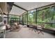 Relaxing screened-in porch, perfect for enjoying the outdoors, with comfortable seating and serene views at 903 Oak Leaf Ct, Altamonte Springs, FL 32714