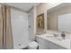 Bathroom with a white vanity, framed art and a shower with brown patterned curtain at 984 Commons Way, Port Orange, FL 32129