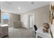 Spacious loft area featuring carpeted floors, a desk, a window, and closet access at 984 Commons Way, Port Orange, FL 32129