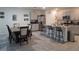 Open kitchen featuring granite countertops, stainless steel appliances, and an island with bar seating at 1596 Park Side Ave, Kissimmee, FL 34744