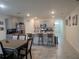 Open kitchen featuring granite countertops, stainless steel appliances, and an island with bar seating at 1596 Park Side Ave, Kissimmee, FL 34744