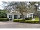 Charming community center with beautiful landscaping and a brick-paved parking area at 103 Golf Club Dr, Longwood, FL 32779