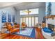 Inviting living room with a cozy fireplace, comfortable seating, and plenty of natural light at 103 Golf Club Dr, Longwood, FL 32779