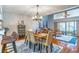 Spacious living room with comfortable seating, wood floors, and a view to the outdoor patio at 103 Golf Club Dr, Longwood, FL 32779