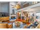Open-concept living room with fireplace, wood floors, and view of loft area at 103 Golf Club Dr, Longwood, FL 32779