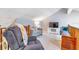 Loft featuring seating area, television, and ample natural light at 103 Golf Club Dr, Longwood, FL 32779
