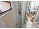 Shower with white and decorative tile, glass door, and modern fixtures at 103 Golf Club Dr, Longwood, FL 32779