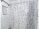 Bright shower featuring a rainfall shower head and stylish white and gray subway tile at 103 Golf Club Dr, Longwood, FL 32779