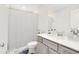 Bathroom with a white shower curtain, under-mount sink, toilet, and neutral wall color at 10915 Leafshore Loop, Orlando, FL 32829