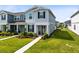 Charming two-story townhome with well-manicured lawn, featuring a welcoming front porch at 10915 Leafshore Loop, Orlando, FL 32829