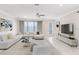 Bright living room with modern decor, large windows, and a comfortable sectional sofa at 10915 Leafshore Loop, Orlando, FL 32829