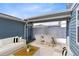Outdoor patio featuring comfortable seating, a modern table setting, and a charming, covered space for relaxing and entertaining at 10915 Leafshore Loop, Orlando, FL 32829