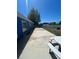 Long backyard featuring a concrete patio and a basketball hoop at 11 Pecan Run Ct, Ocala, FL 34472
