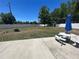 Large backyard featuring a concrete patio, picnic table and firepit at 11 Pecan Run Ct, Ocala, FL 34472