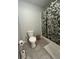 Bathroom featuring a toilet, shower with curtain, and toilet paper holder at 11 Pecan Run Ct, Ocala, FL 34472