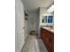Bathroom featuring double sinks, granite countertops, and a new rug at 11 Pecan Run Ct, Ocala, FL 34472