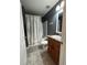 Cozy bathroom showcasing a shower-tub combination and single sink vanity at 11 Pecan Run Ct, Ocala, FL 34472