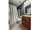 Cozy bathroom showcasing a shower-tub combination and single sink vanity at 11 Pecan Run Ct, Ocala, FL 34472
