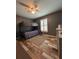 Bedroom features a bunk bed, modern fan, and new floor at 11 Pecan Run Ct, Ocala, FL 34472