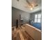 Bedroom with a ceiling fan, natural light, a small vanity and wood-look floors at 11 Pecan Run Ct, Ocala, FL 34472