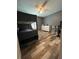 Bedroom features a bunk bed, modern fan, and new floor at 11 Pecan Run Ct, Ocala, FL 34472