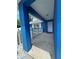 Inviting front porch with blue columns, white picket fence, and a welcoming entrance to the home at 11 Pecan Run Ct, Ocala, FL 34472