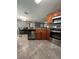 Well lit kitchen with stainless steel appliances and tile floors at 11 Pecan Run Ct, Ocala, FL 34472