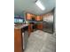 Functional kitchen with stainless steel appliances, ample cabinetry, and tile flooring at 11 Pecan Run Ct, Ocala, FL 34472