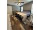The main bedroom is spacious with lots of natural light and modern fan at 11 Pecan Run Ct, Ocala, FL 34472