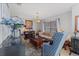 Bright living room showcasing a patterned rug, vintage furniture, and ample natural light at 114 Shaddock Dr, Auburndale, FL 33823