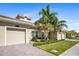 Charming home with lush landscaping, well-manicured lawn, and a two-car garage at 1161 Trappers Trail Loop, Davenport, FL 33896