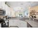 Modern kitchen with sleek countertops, stainless steel appliances, and stylish decor at 1161 Trappers Trail Loop, Davenport, FL 33896