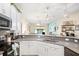Modern kitchen featuring stylish décor, stainless steel appliances, and ample counter space at 1161 Trappers Trail Loop, Davenport, FL 33896