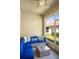 Cozy lanai features a comfortable blue cushioned seating area and a glass topped coffee table at 1161 Trappers Trail Loop, Davenport, FL 33896