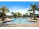 Community pool area features palm trees, lounge chairs and umbrellas for resident's enjoyment at 1161 Trappers Trail Loop, Davenport, FL 33896