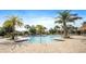 A community pool, and beautiful landscaping at 1161 Trappers Trail Loop, Davenport, FL 33896