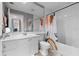 Bathroom with a large mirror, vanity, and tub-shower combination at 11908 Delfina Ln, Orlando, FL 32827